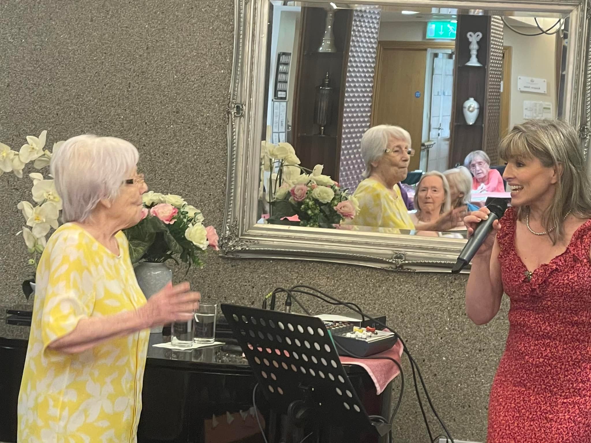 Entertainer Singing to Residents and Resident Dancing